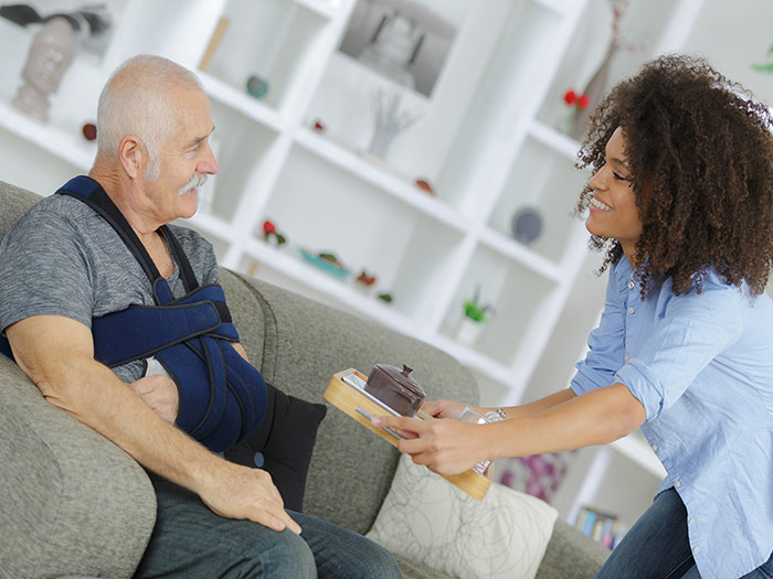 Carer helping patient