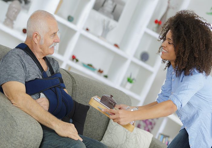 Carer helping patient